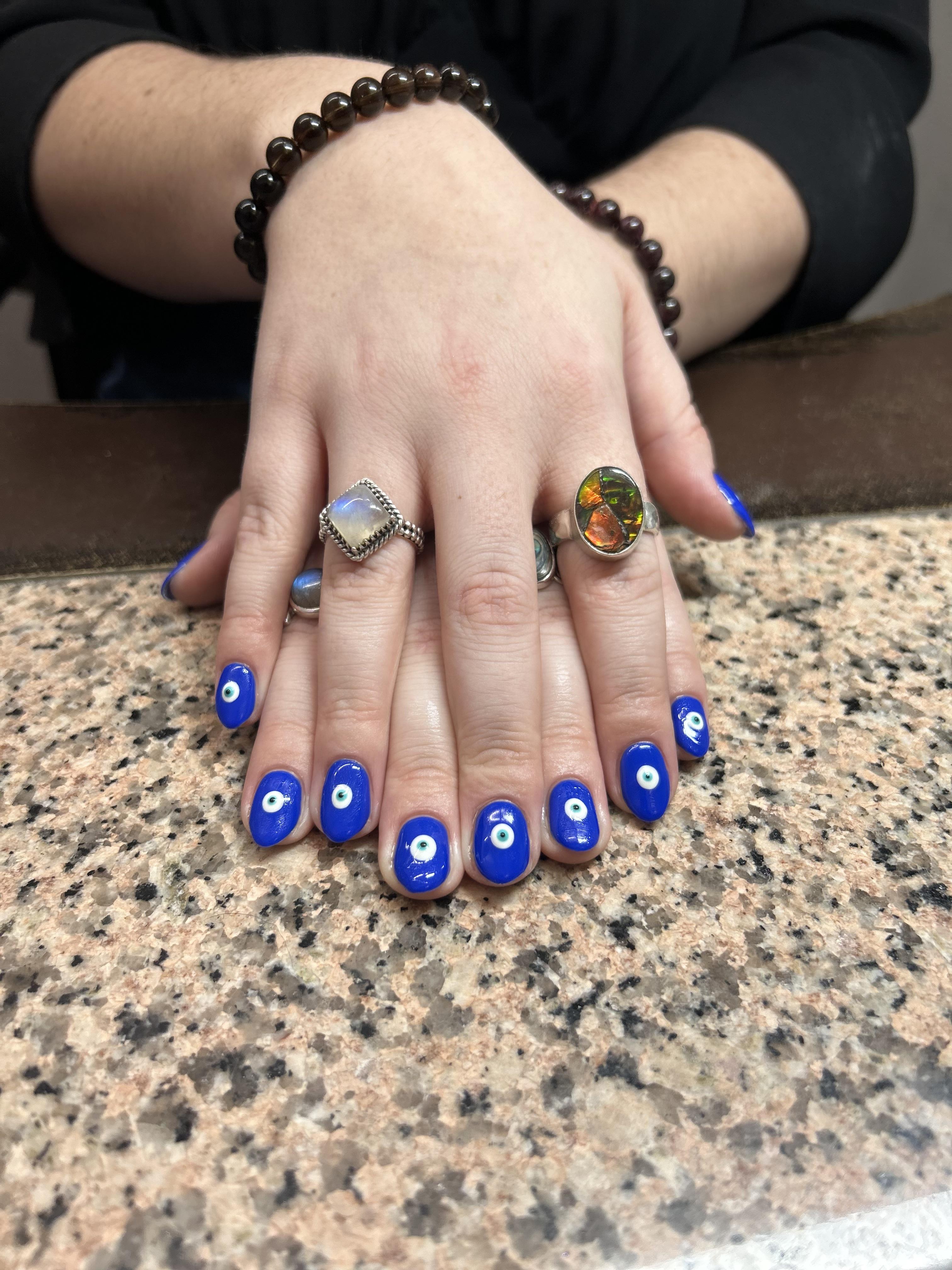 blue evil eye nail art